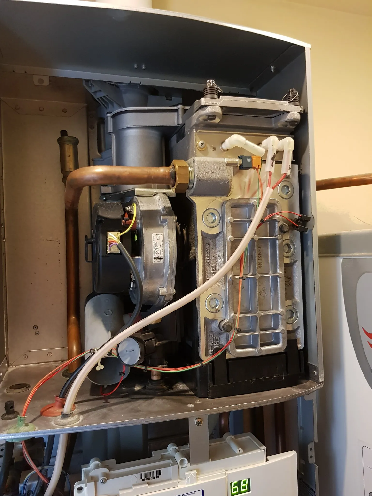 Open boiler showing internal components during a repair